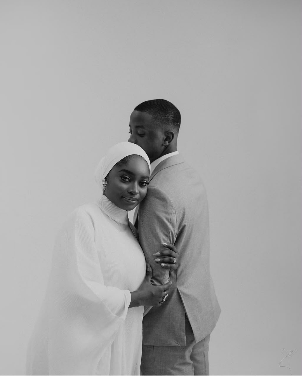 Black and white portrait of a couple embracing