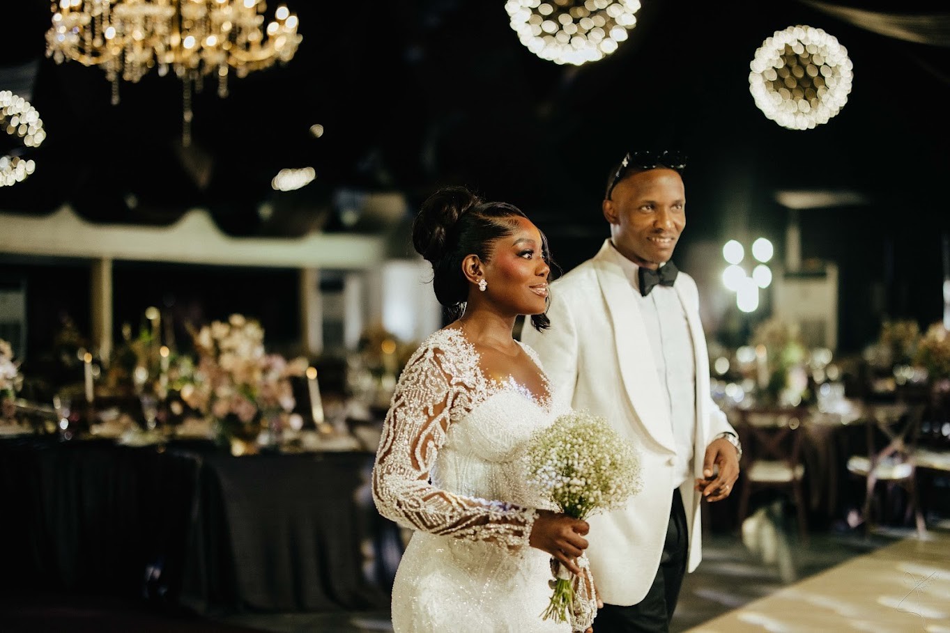 Nkiru and Osita entering their reception together